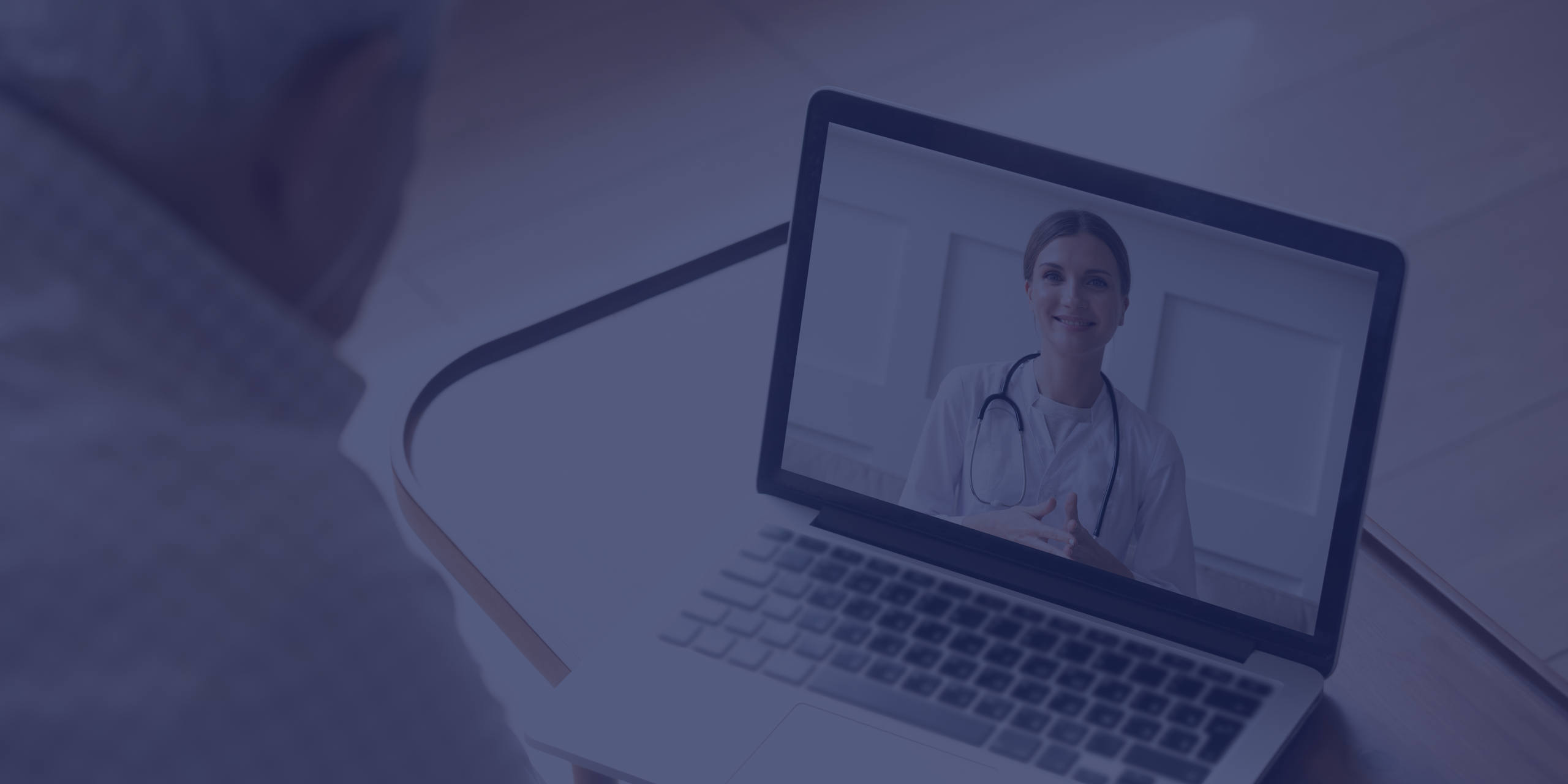 A Manitoba physician consulting with a patient over a video call
