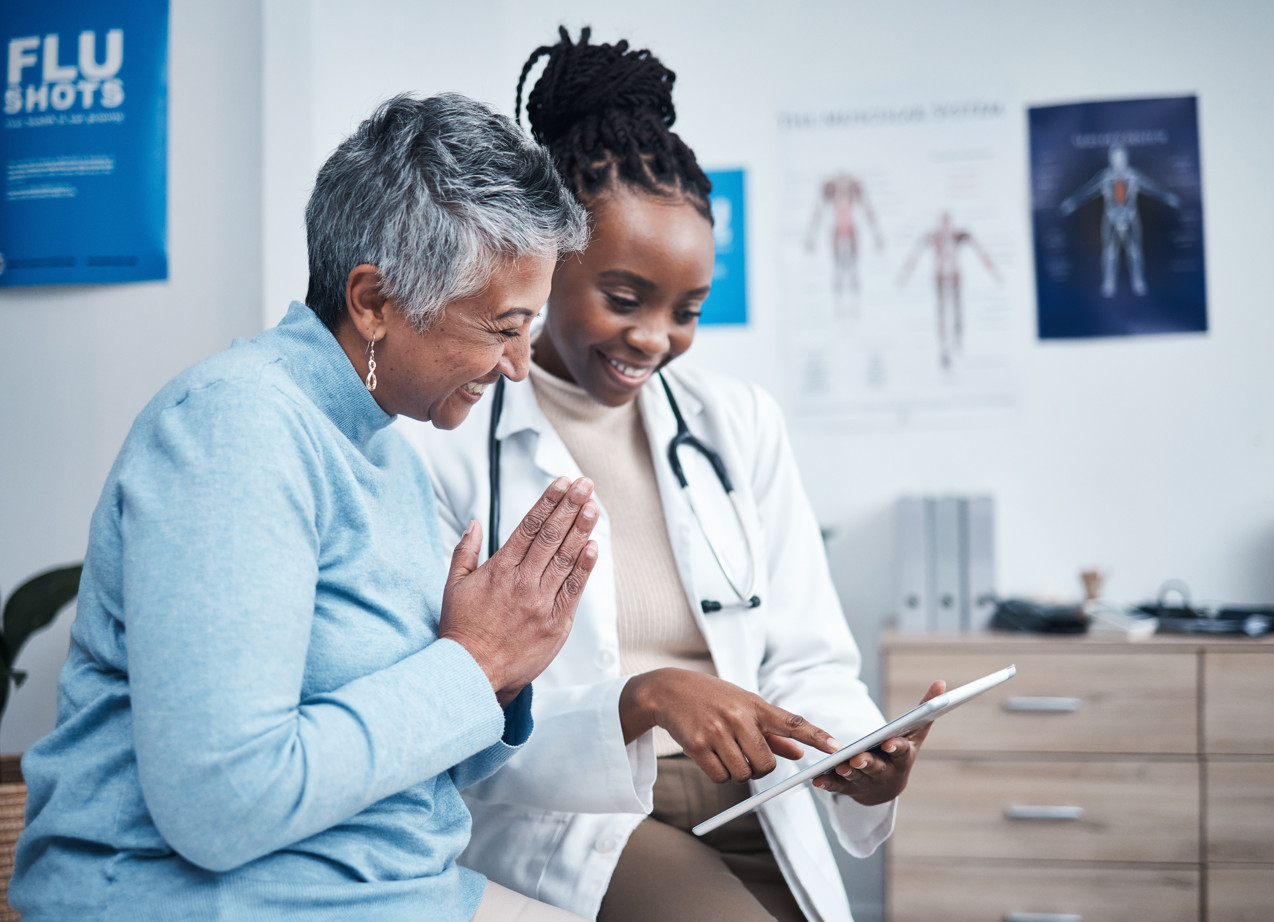 A patient speaking with a Manitoba physician on a video call at home