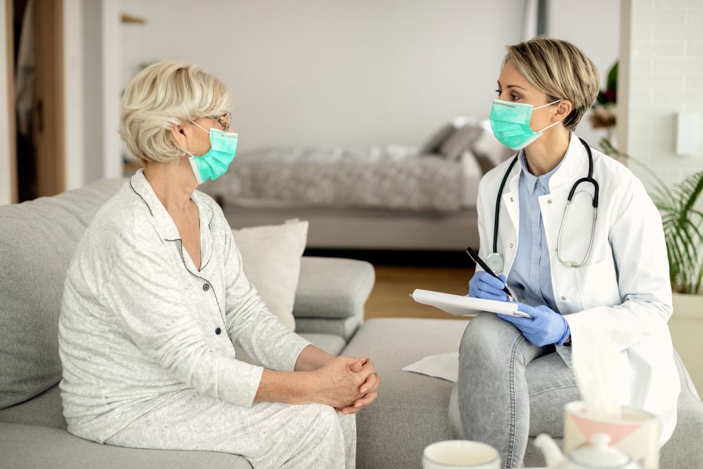 Doctors-To-You physician examining a patient during an in-home visit in Winnipeg