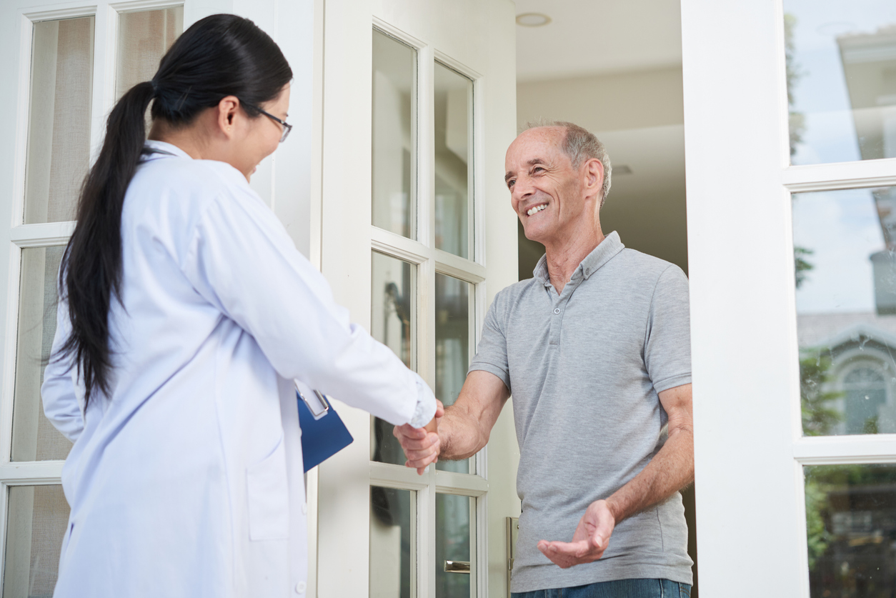 Doctors-To-You physician greeting a senior patient at the door of their Winnipeg home
